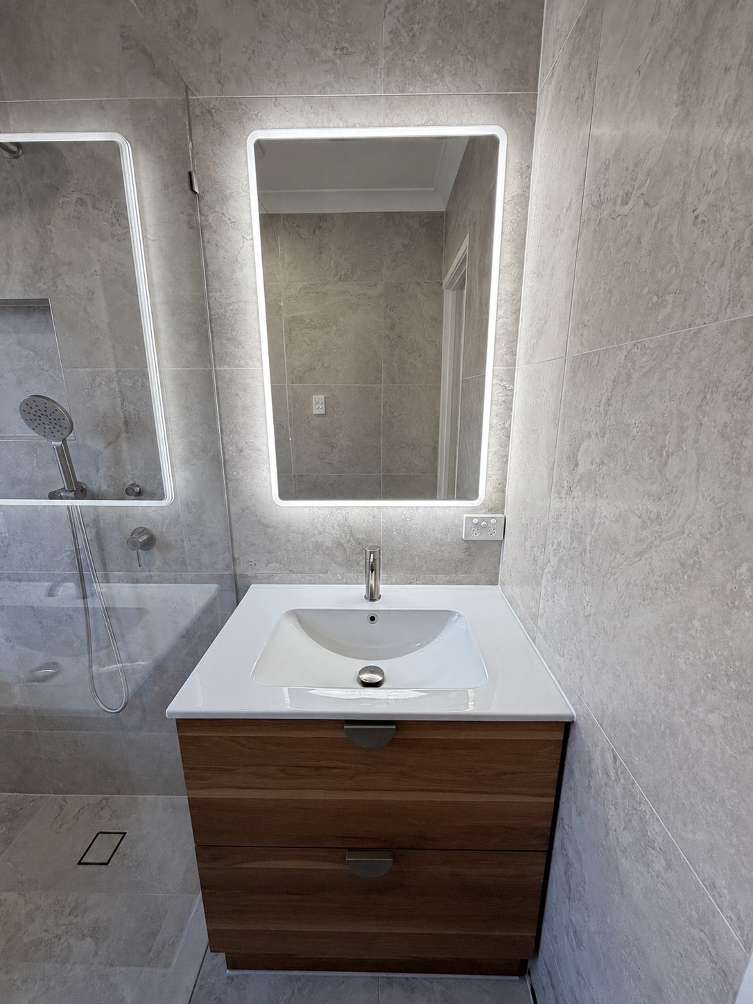 Bathroom renovation — single vanity, LED mirror