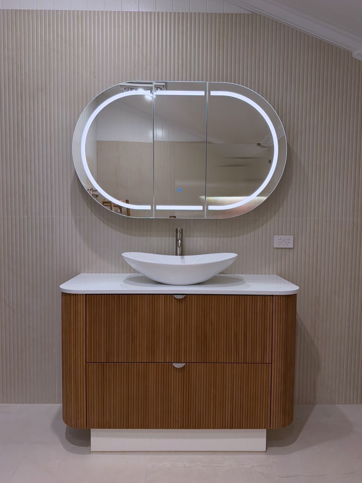 Bathroom renovation — timber vanity with backlit LED oval mirror